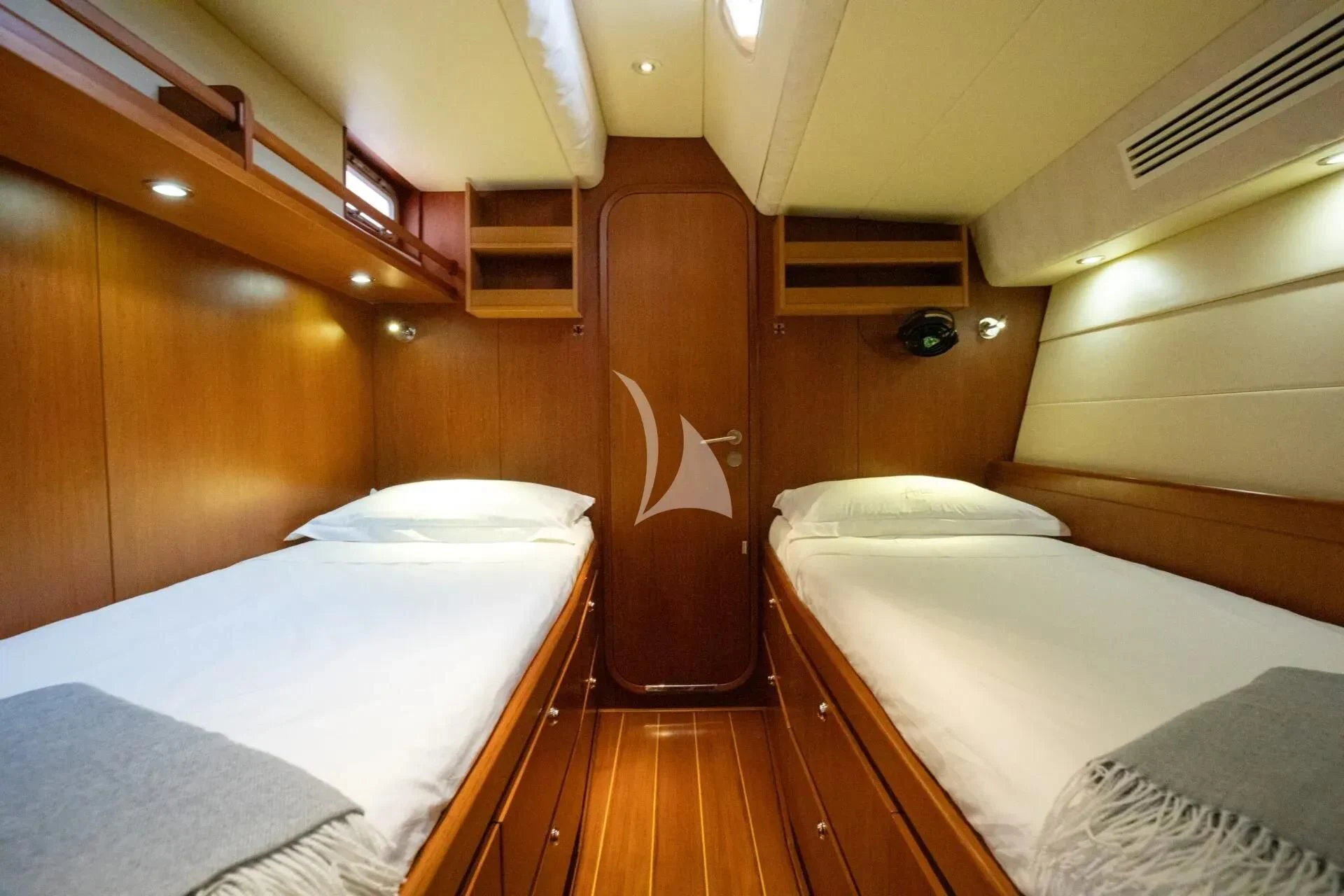 a room with two beds aboard ARIA Yacht for Charter