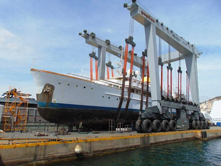a large white boat with red and blue paint aboard HASABI II Yacht for Sale