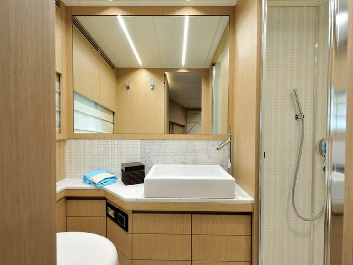 a bathroom with a sink and a mirror aboard AUSTIN PARKER - 72 FLY Yacht for Sale