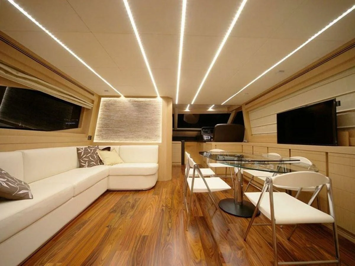 a living room with a couch and a table aboard AUSTIN PARKER - 72 FLY Yacht for Sale