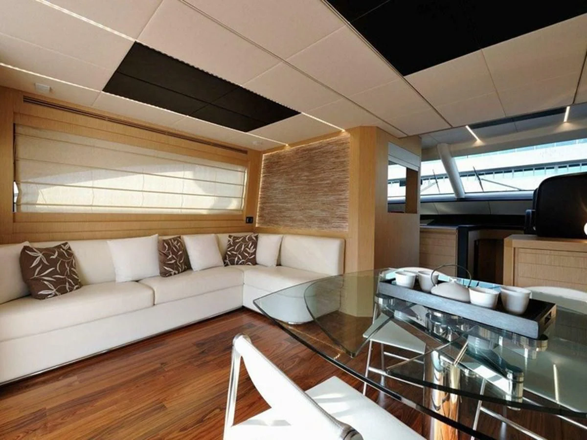 a living room with a couch and a table aboard AUSTIN PARKER - 72 FLY Yacht for Sale