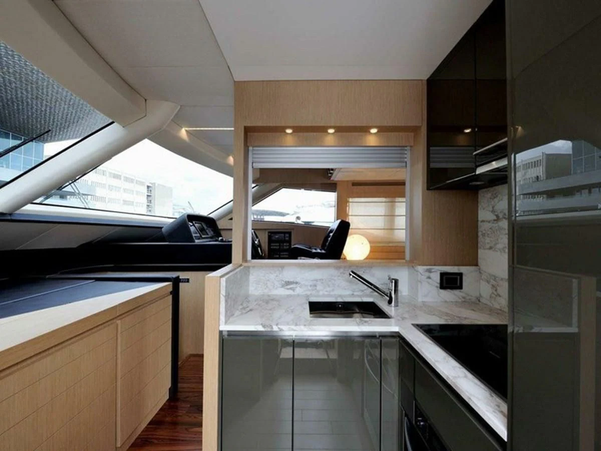 a kitchen with a large window aboard AUSTIN PARKER - 72 FLY Yacht for Sale