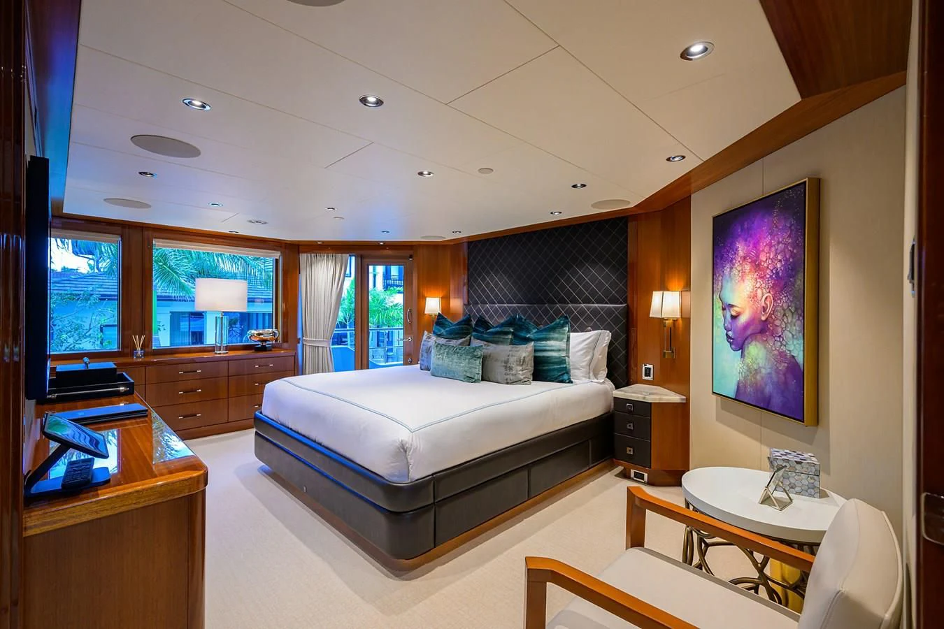 a bedroom with a bed and desk aboard NEENAH Yacht for Charter