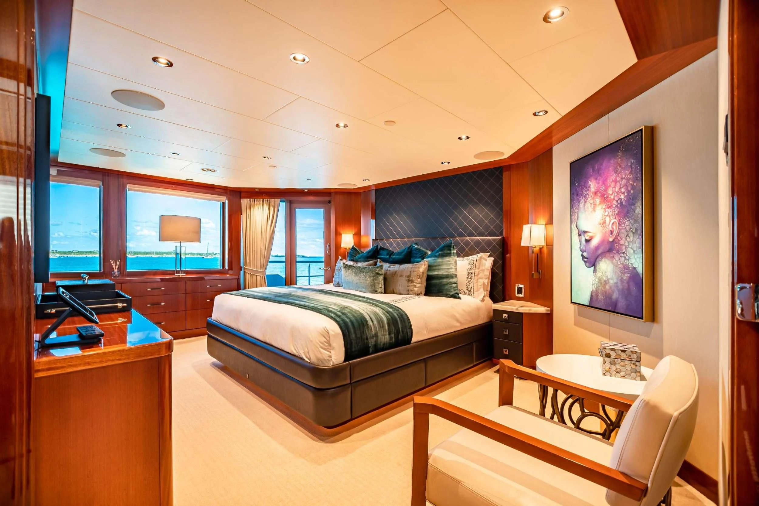a bedroom with a bed and a desk aboard NEENAH Yacht for Charter