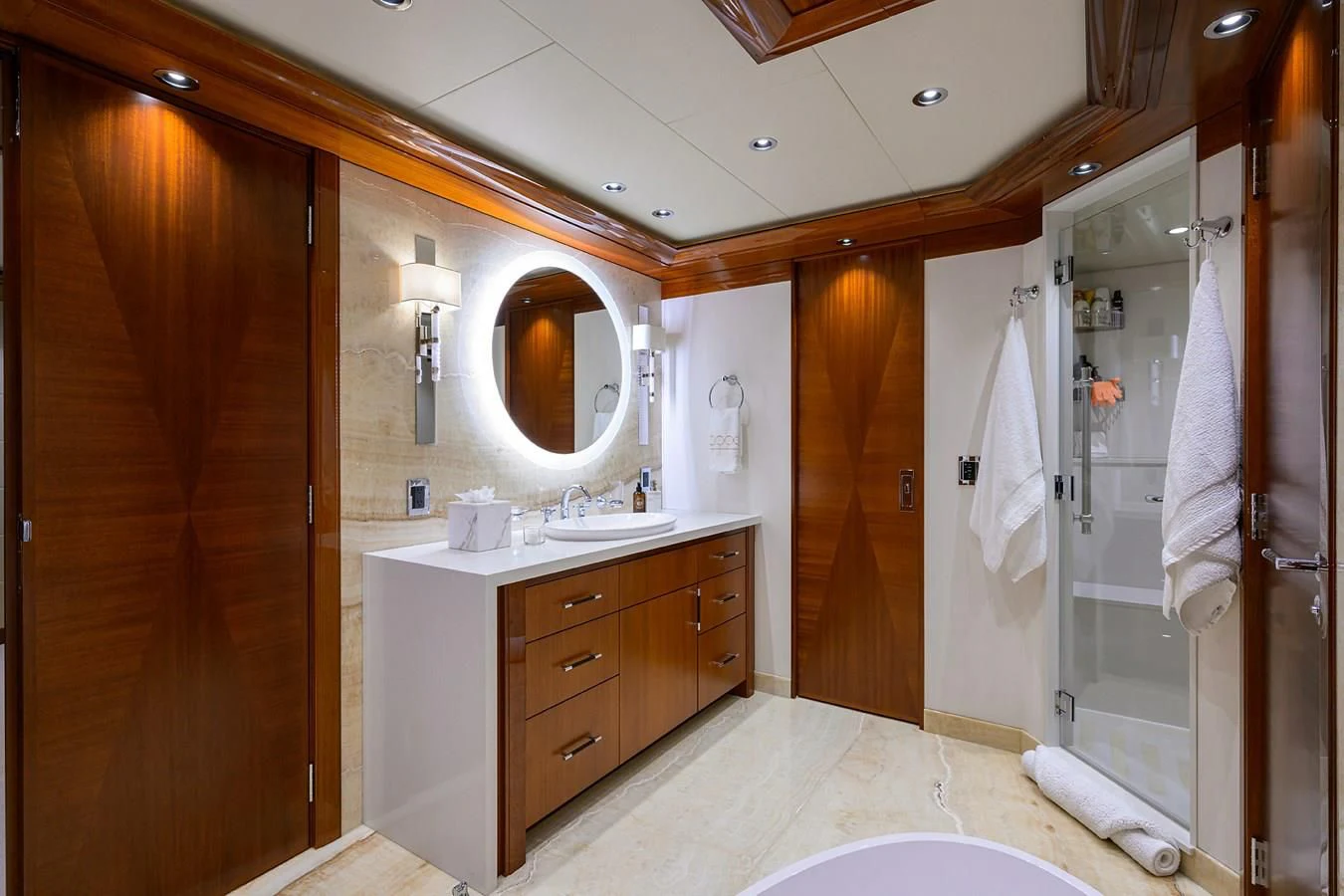 a bathroom with a large mirror aboard NEENAH Yacht for Charter
