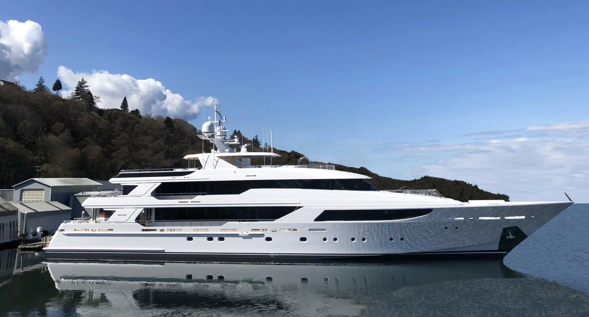a yacht docked at a pier aboard NEENAH Yacht for Charter