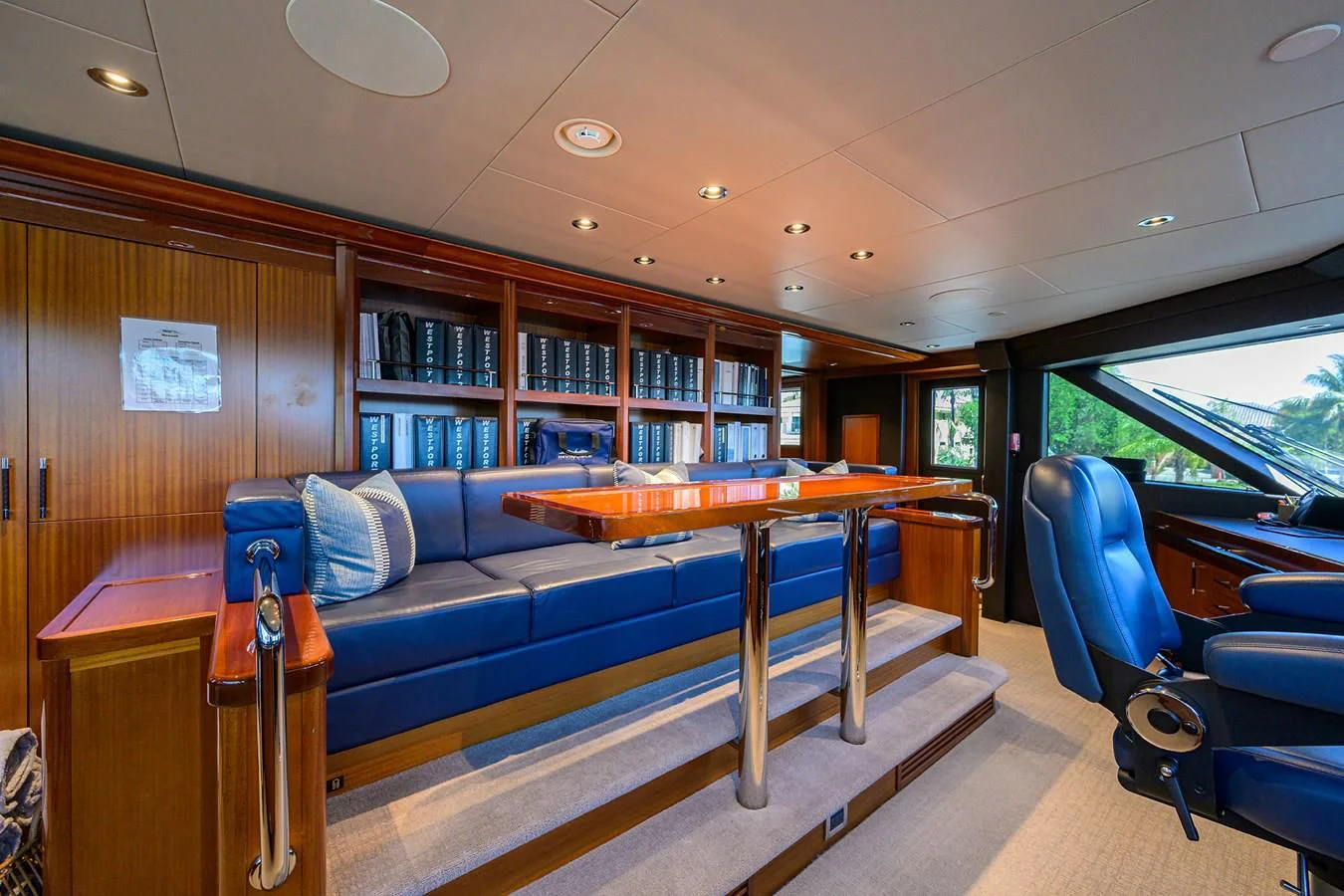 a room with a pool table and chairs aboard NEENAH Yacht for Charter
