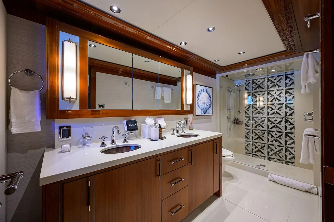 a bathroom with a glass shower aboard NEENAH Yacht for Charter