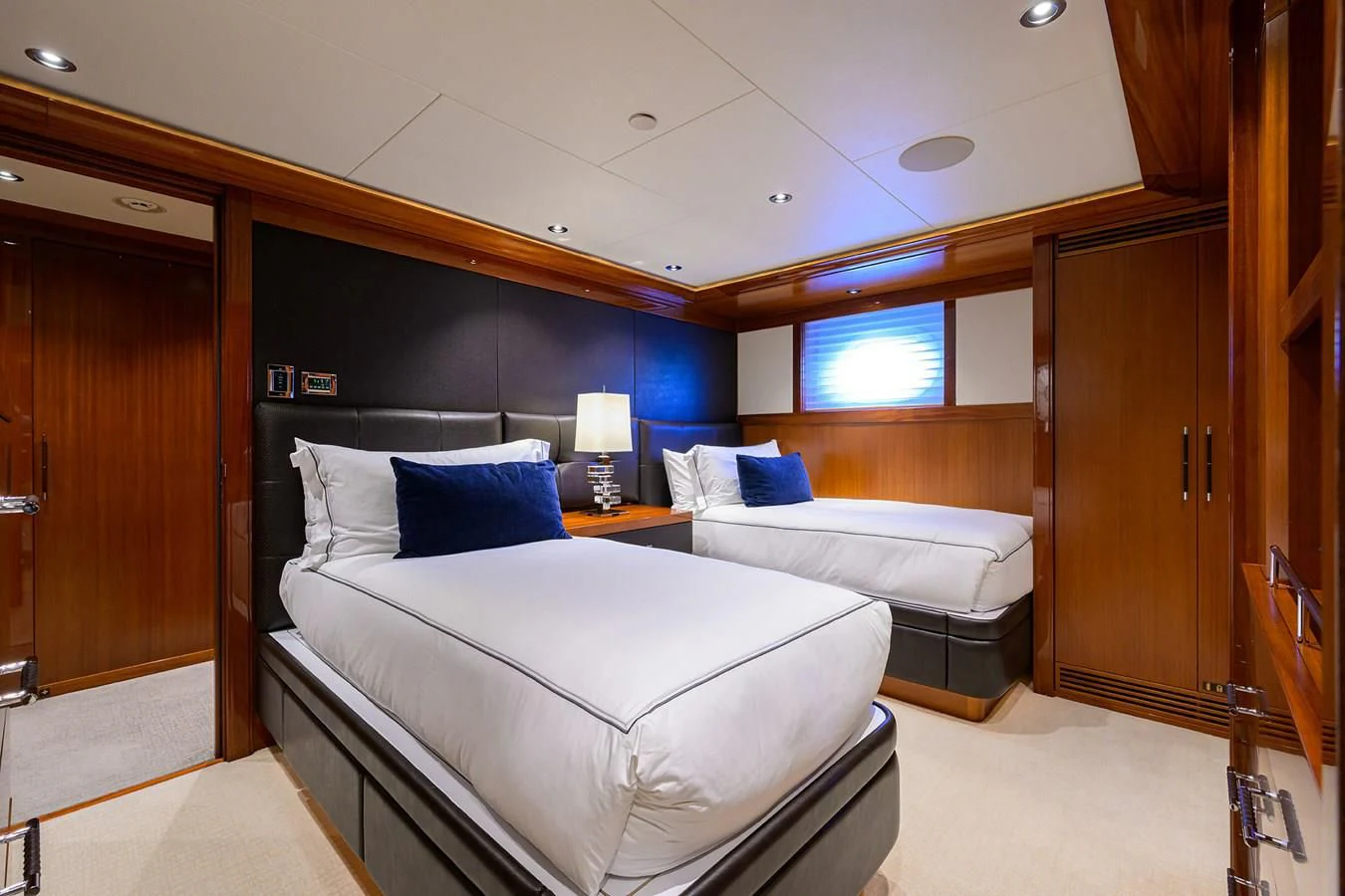 a room with a bed and a desk aboard NEENAH Yacht for Charter
