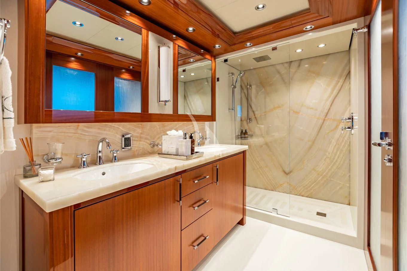 a bathroom with a large mirror aboard NEENAH Yacht for Charter