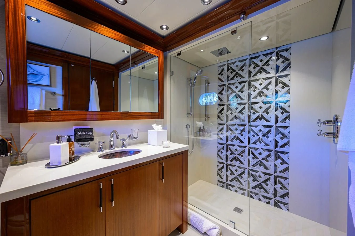 a bathroom with a shower unit and sink aboard NEENAH Yacht for Charter