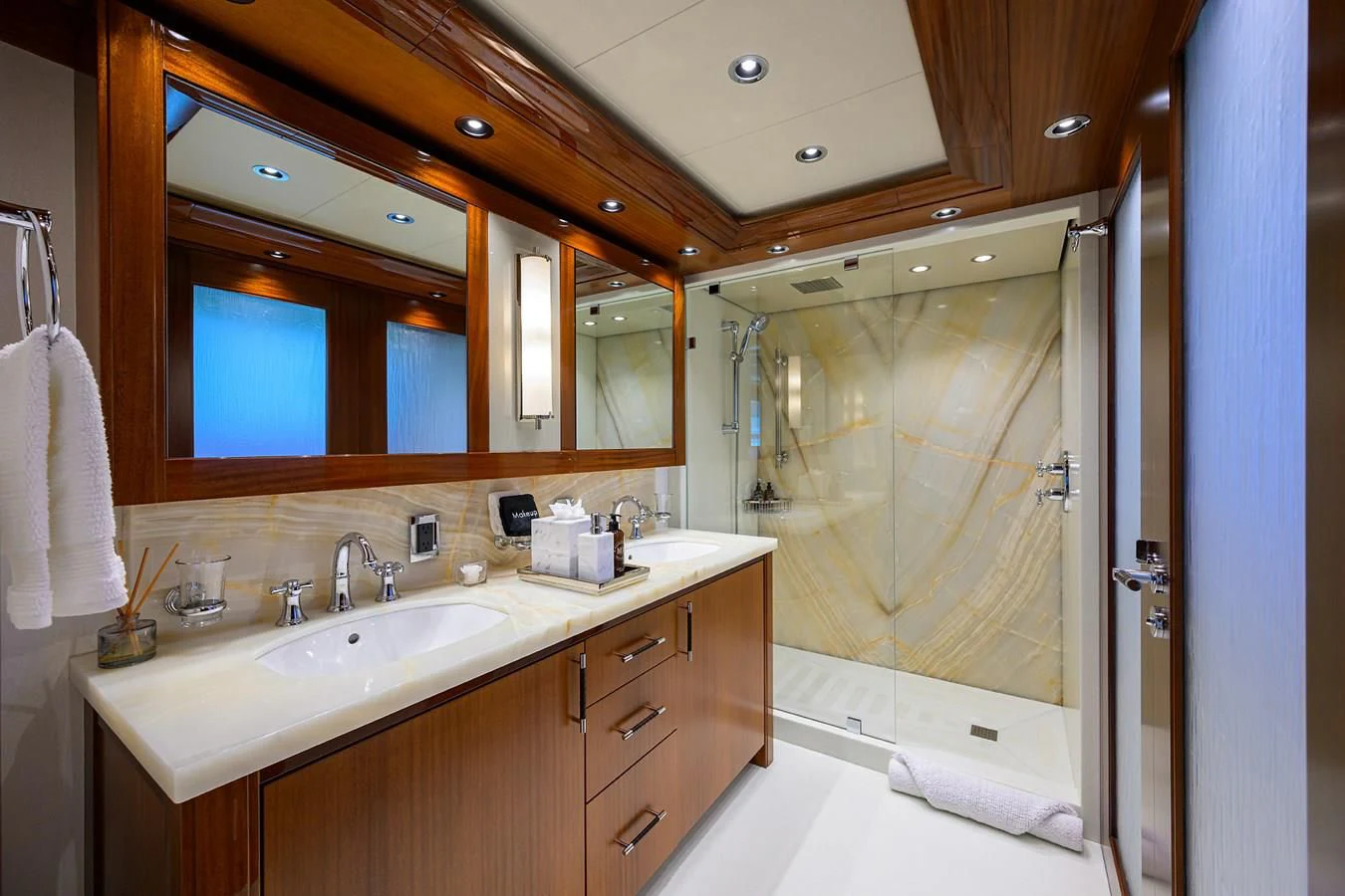 a bathroom with a large mirror aboard NEENAH Yacht for Charter