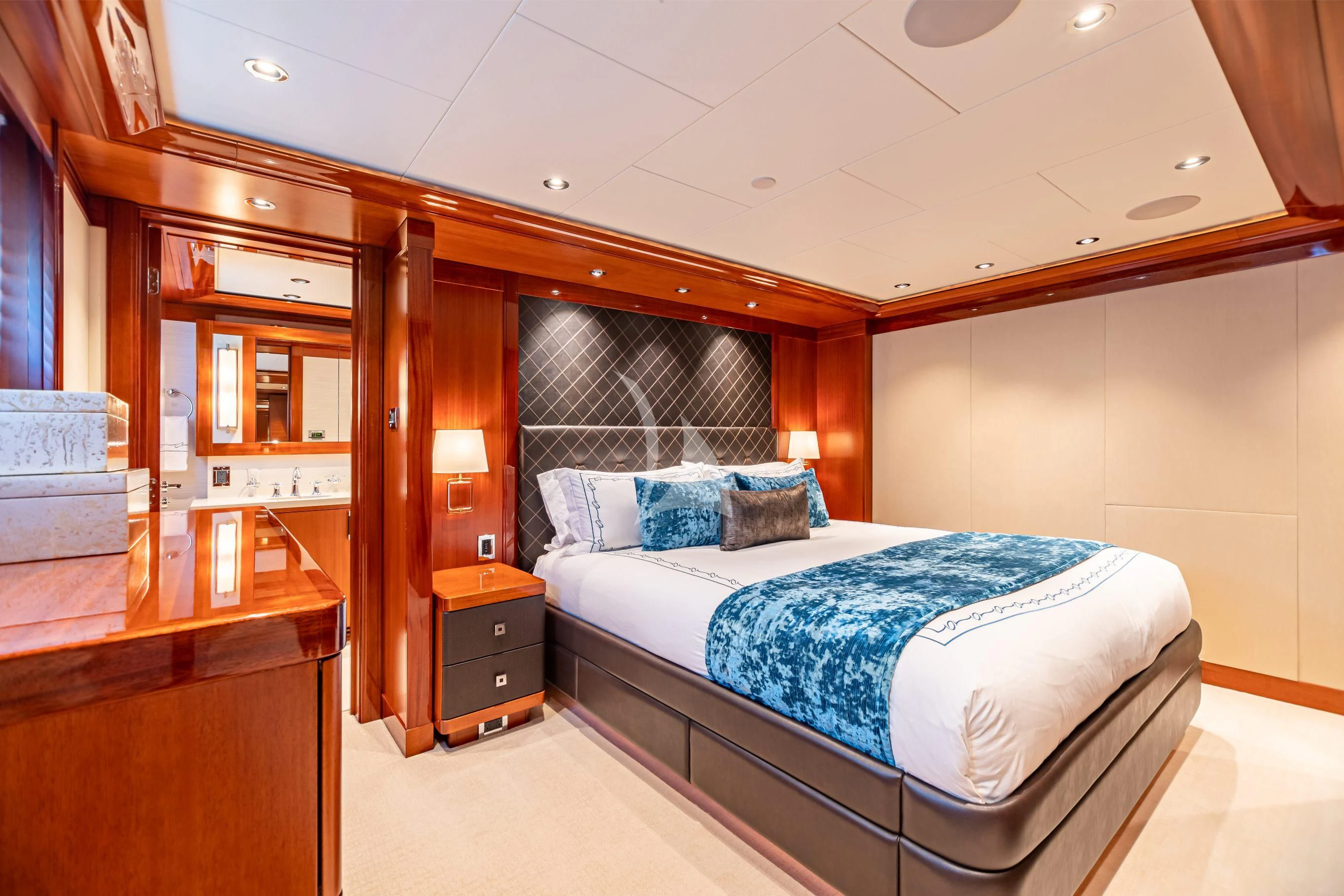 a bedroom with a bed and a desk aboard NEENAH Yacht for Charter