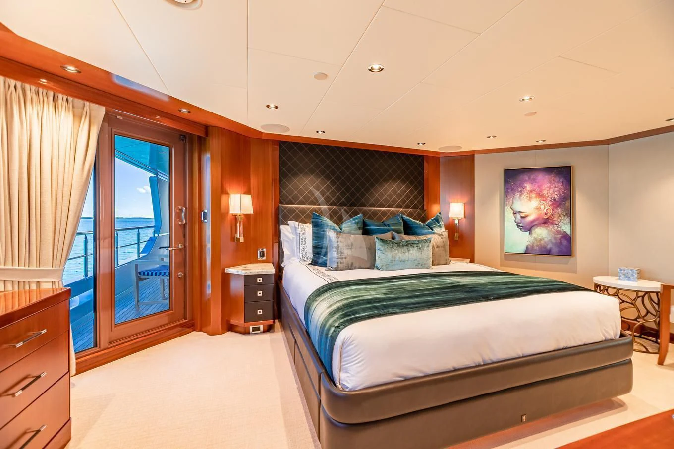 a bedroom with a bed and a window aboard NEENAH Yacht for Charter