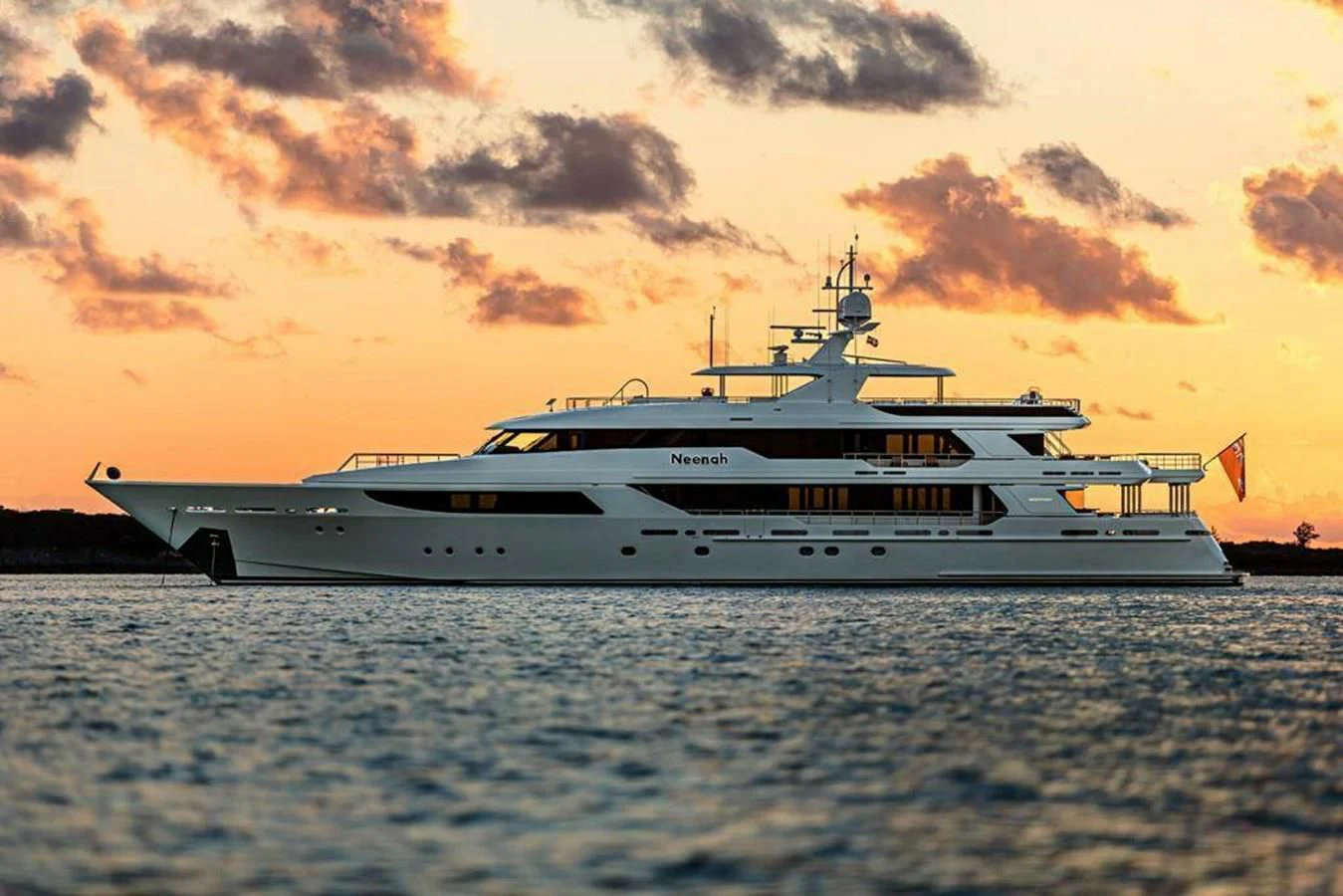 a white yacht on the water aboard NEENAH Yacht for Charter