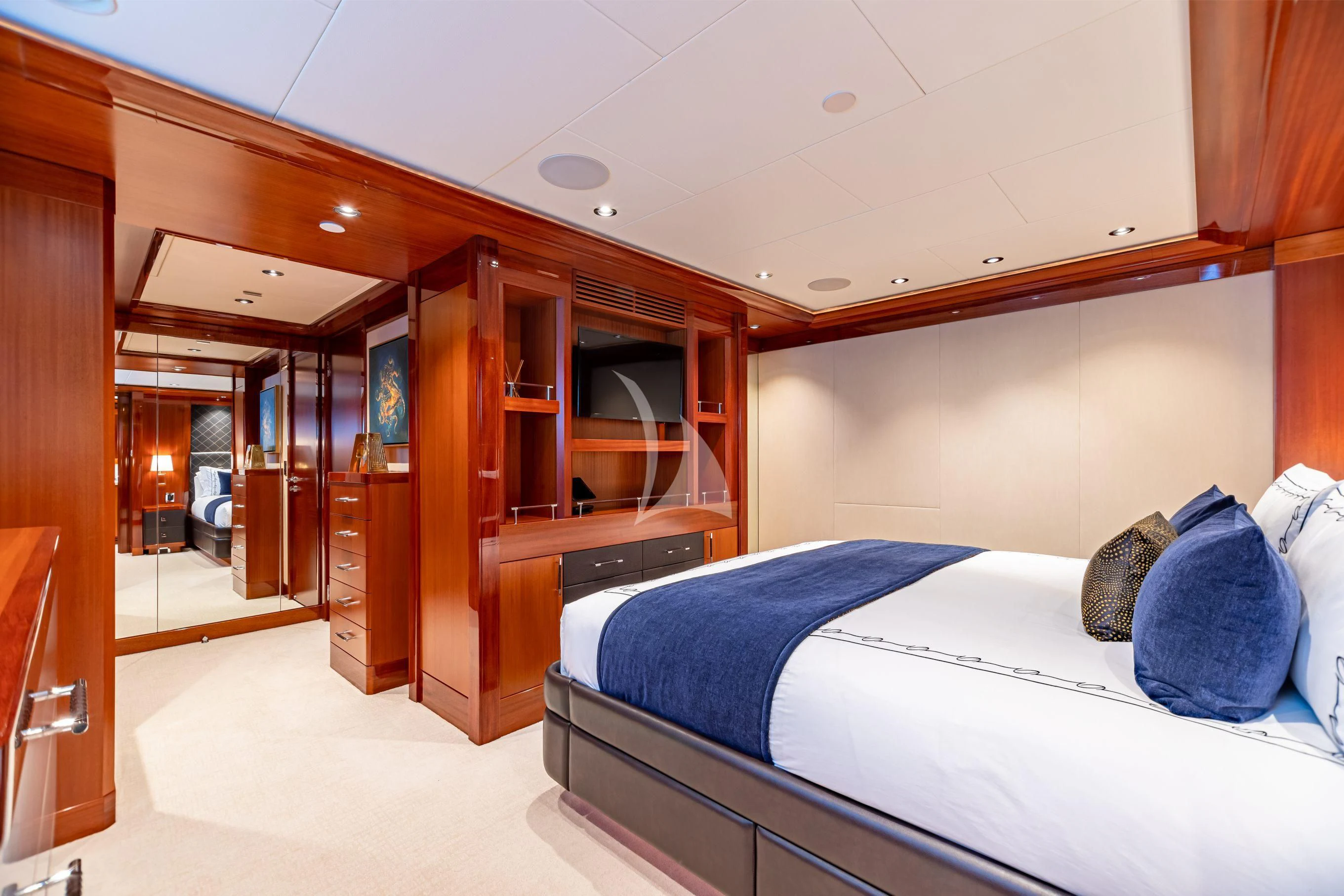 a room with a bed and a closet aboard NEENAH Yacht for Charter