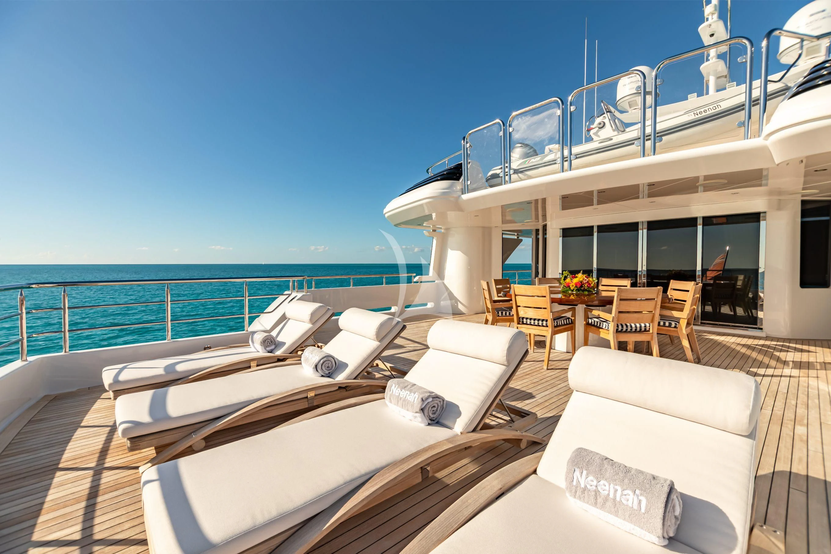 a large white boat on a deck aboard NEENAH Yacht for Charter