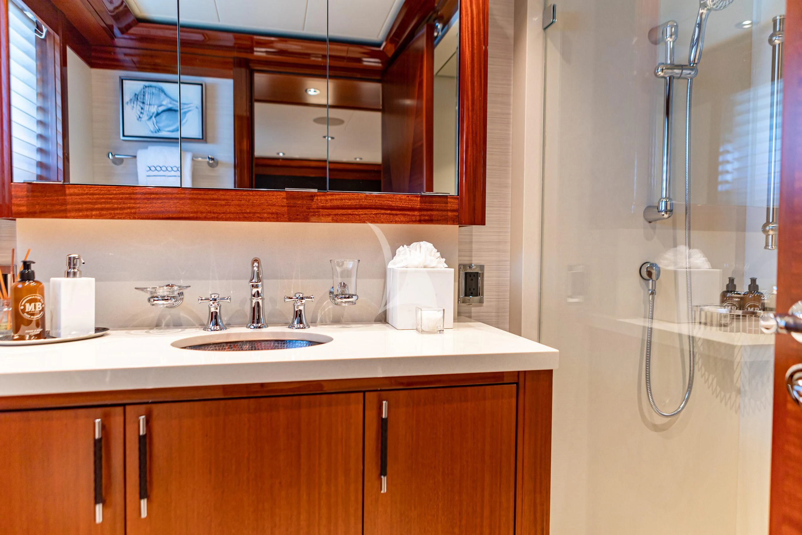 a bathroom with a sink and a mirror aboard NEENAH Yacht for Charter