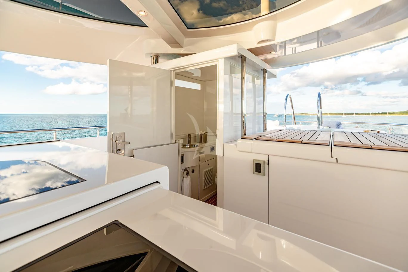 a kitchen with a large window aboard NEENAH Yacht for Charter