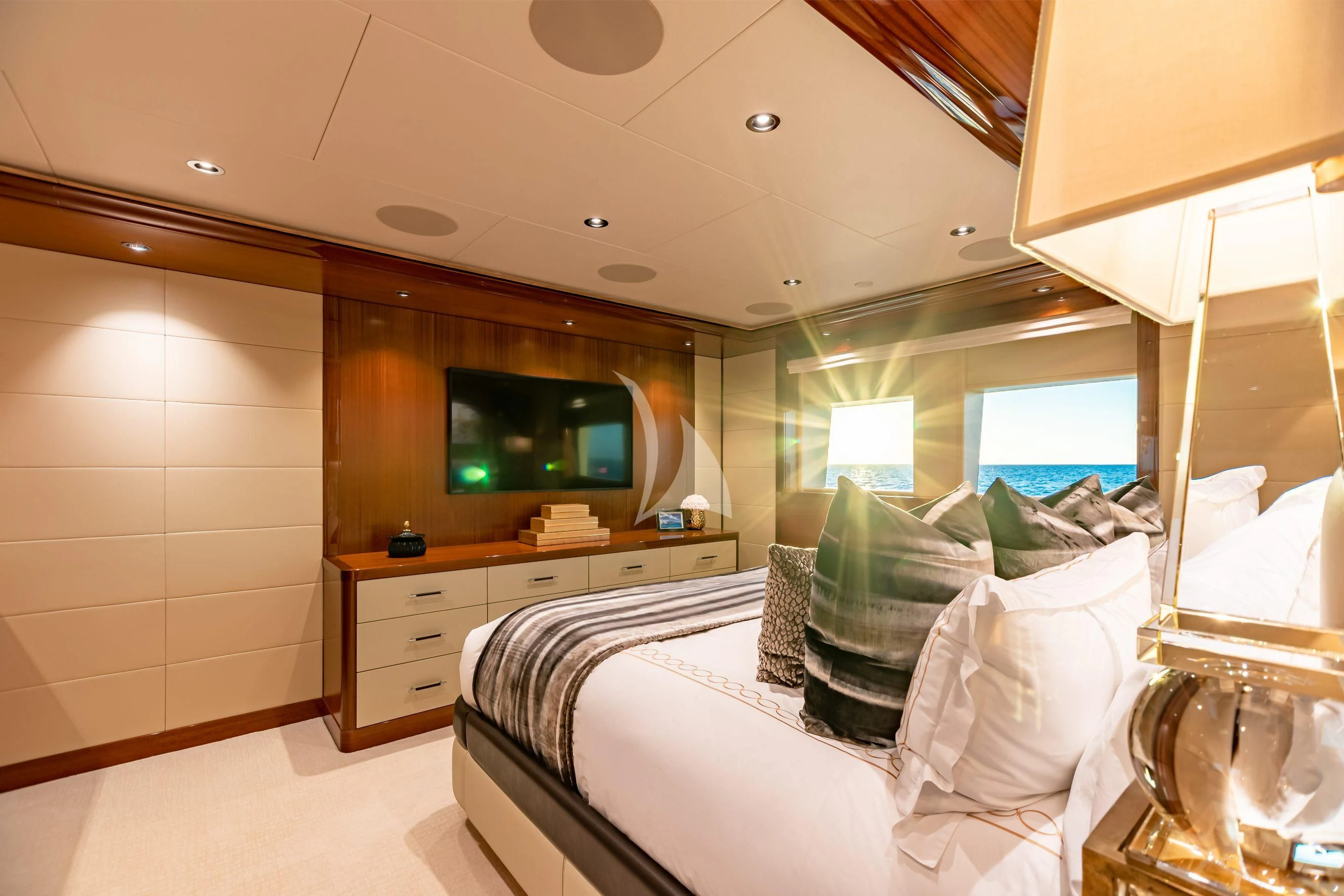a hotel room with a bed and tv aboard NEENAH Yacht for Charter
