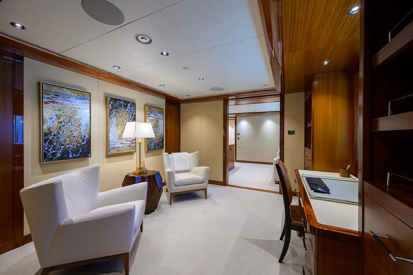 a room with a table chairs and a lamp aboard NEENAH Yacht for Charter