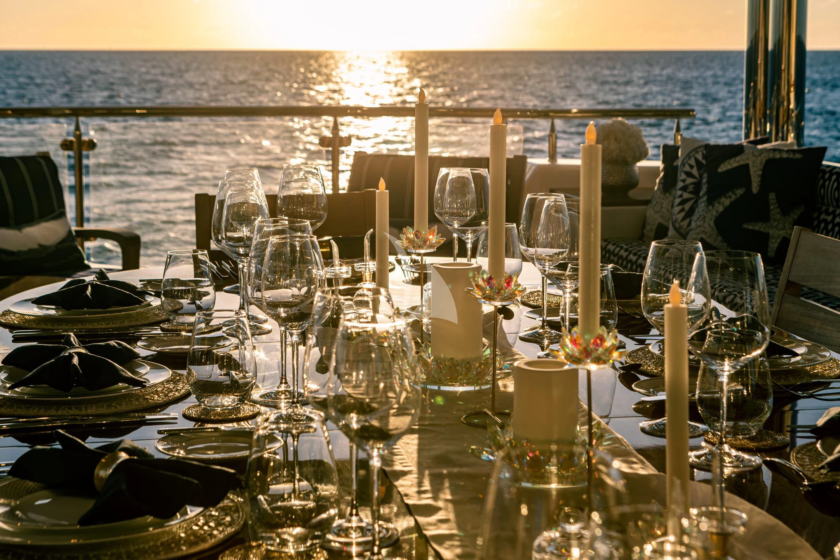 a table set for a dinner party aboard NEENAH Yacht for Charter