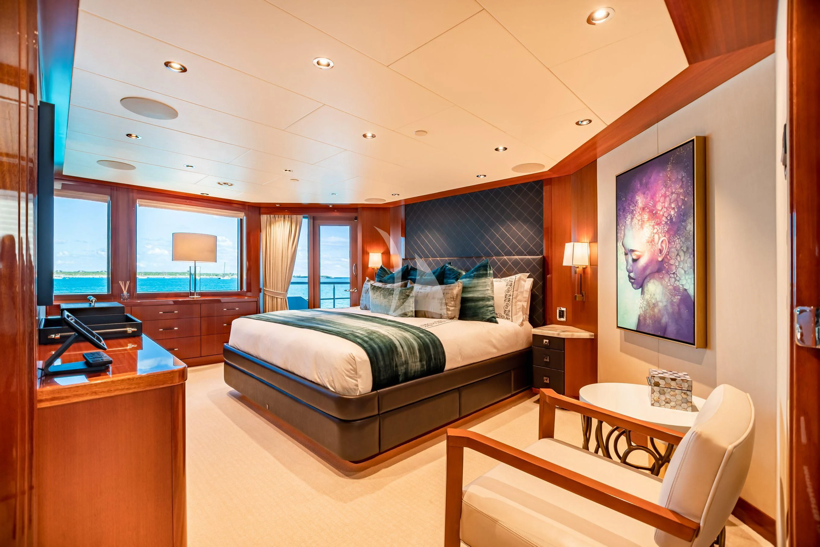 a bedroom with a bed and desk aboard NEENAH Yacht for Charter
