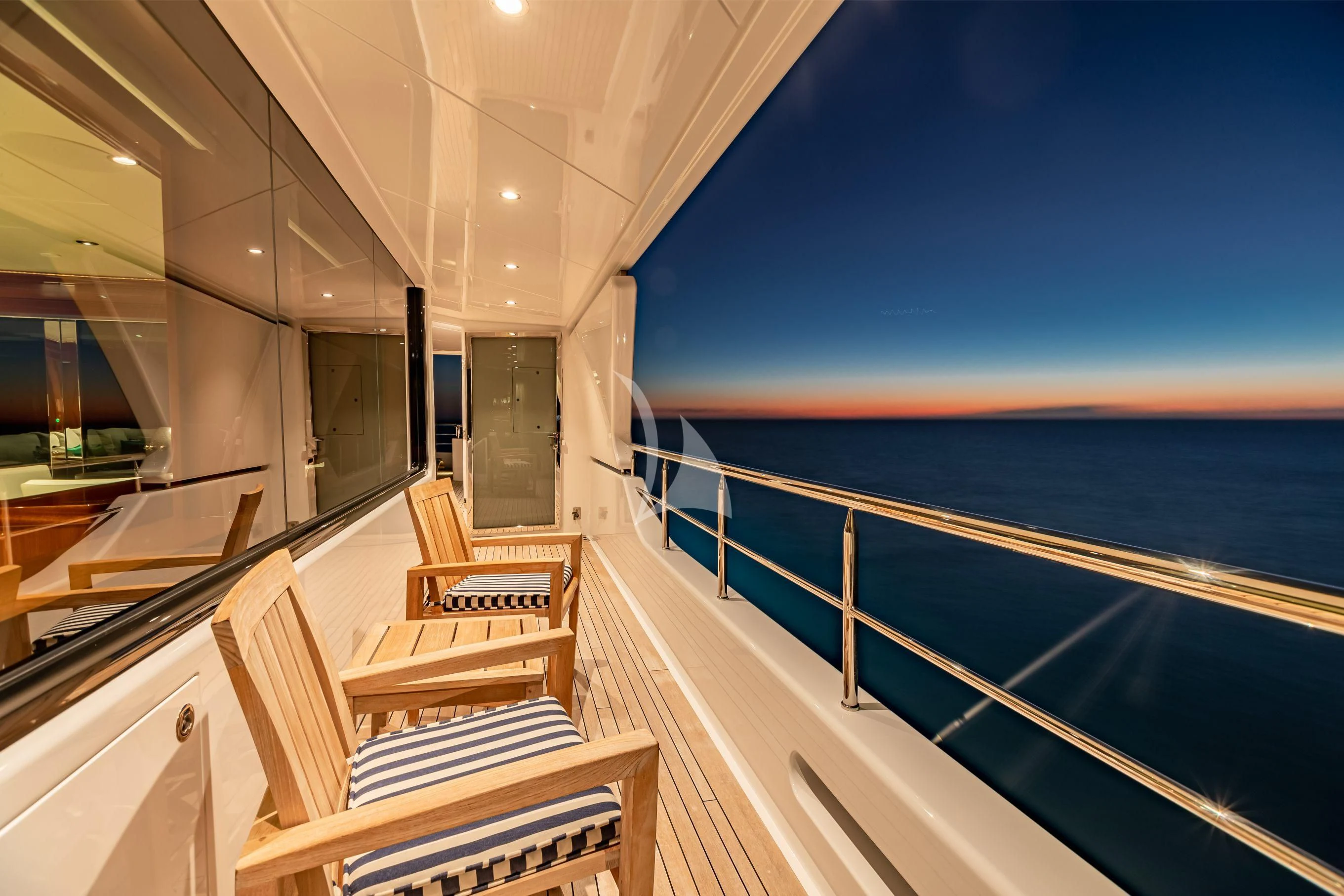 a balcony overlooking a pool aboard NEENAH Yacht for Charter