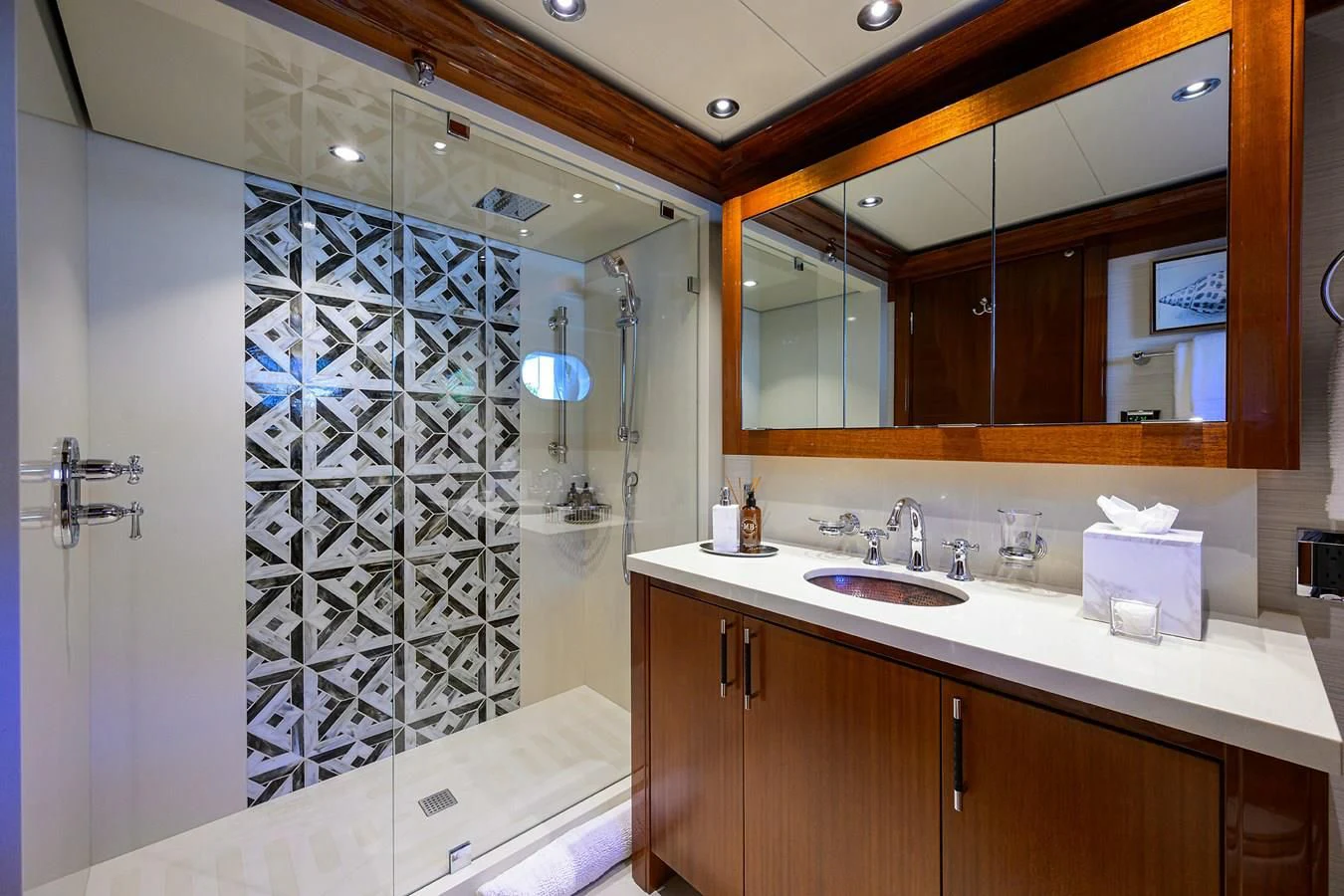a bathroom with a shower unit and sink aboard NEENAH Yacht for Charter