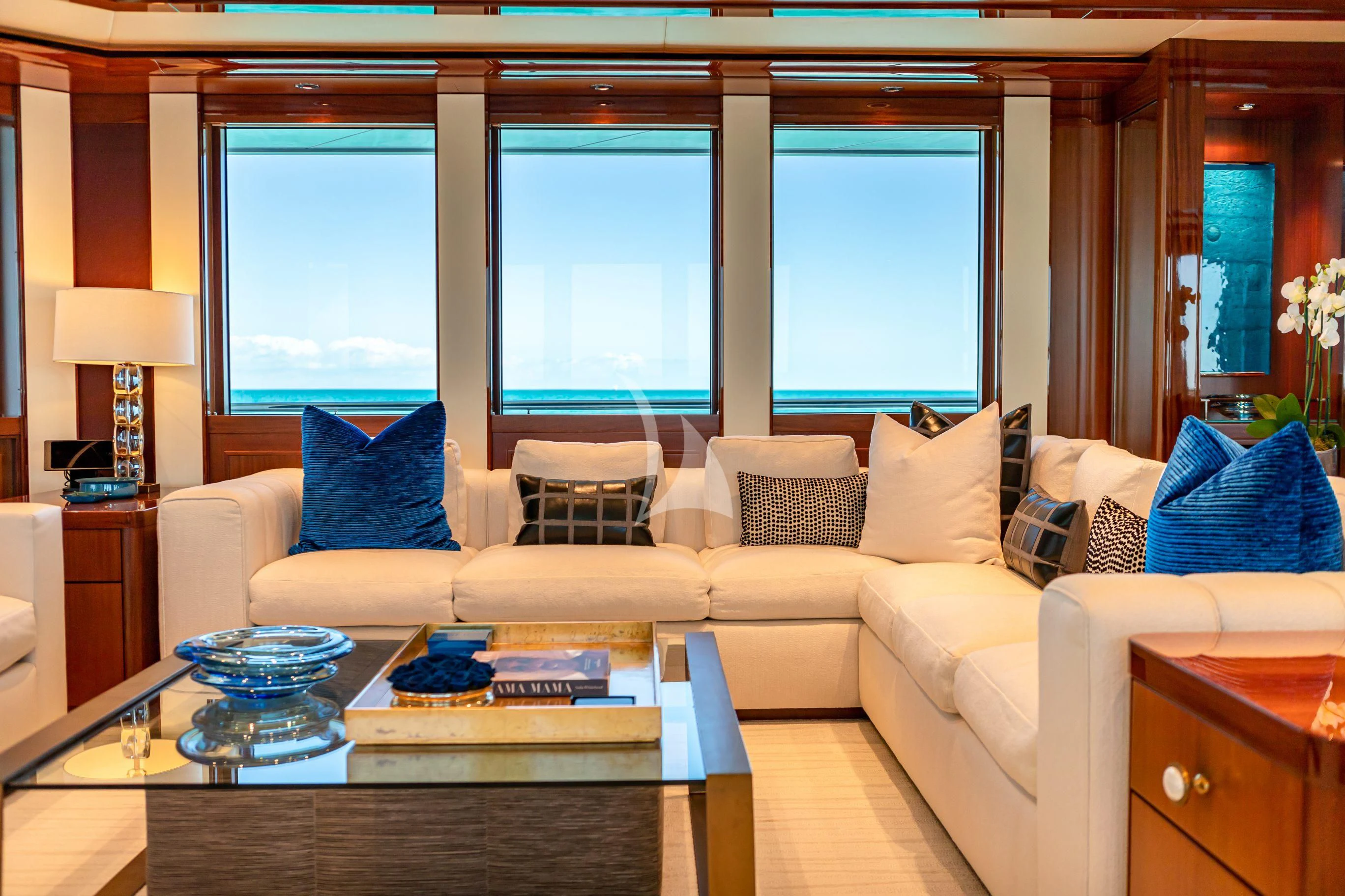 a living room with a large window aboard NEENAH Yacht for Charter
