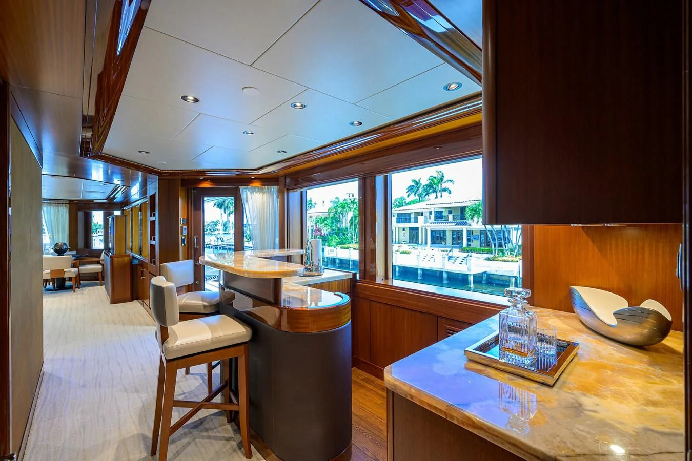 a room with a table chairs and a window aboard NEENAH Yacht for Charter