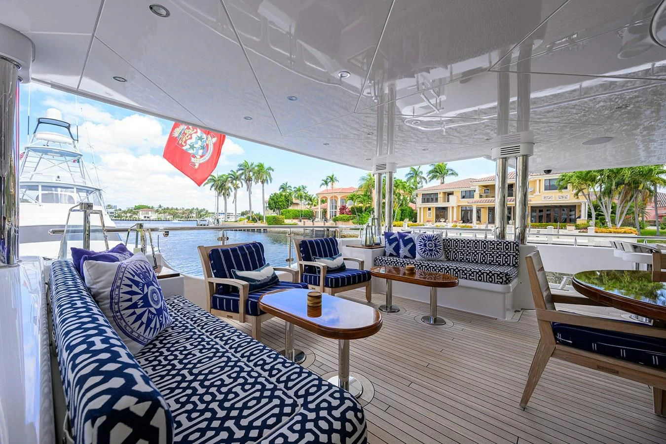 a room with a table chairs and a view of the water aboard NEENAH Yacht for Charter