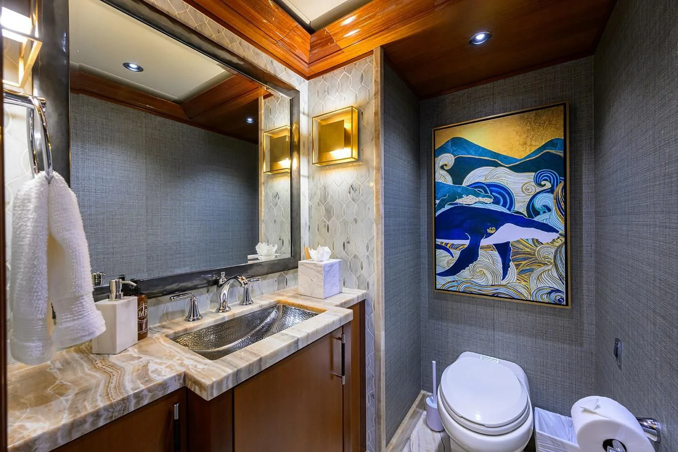 a bathroom with a painting aboard NEENAH Yacht for Charter