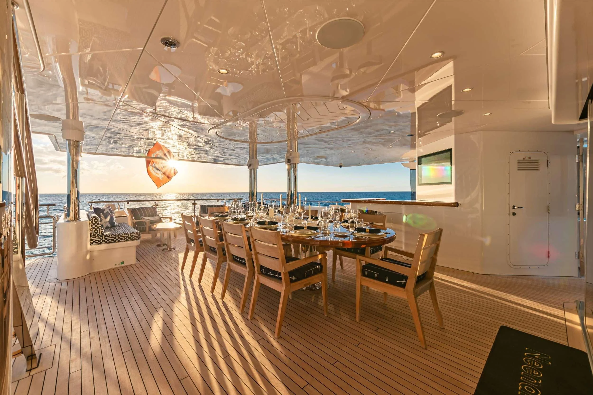 a room with tables and chairs aboard NEENAH Yacht for Charter