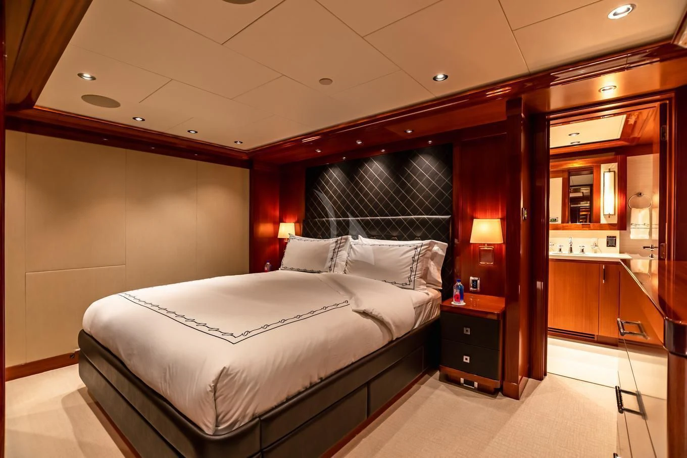 a room with a bed and a desk aboard NEENAH Yacht for Charter