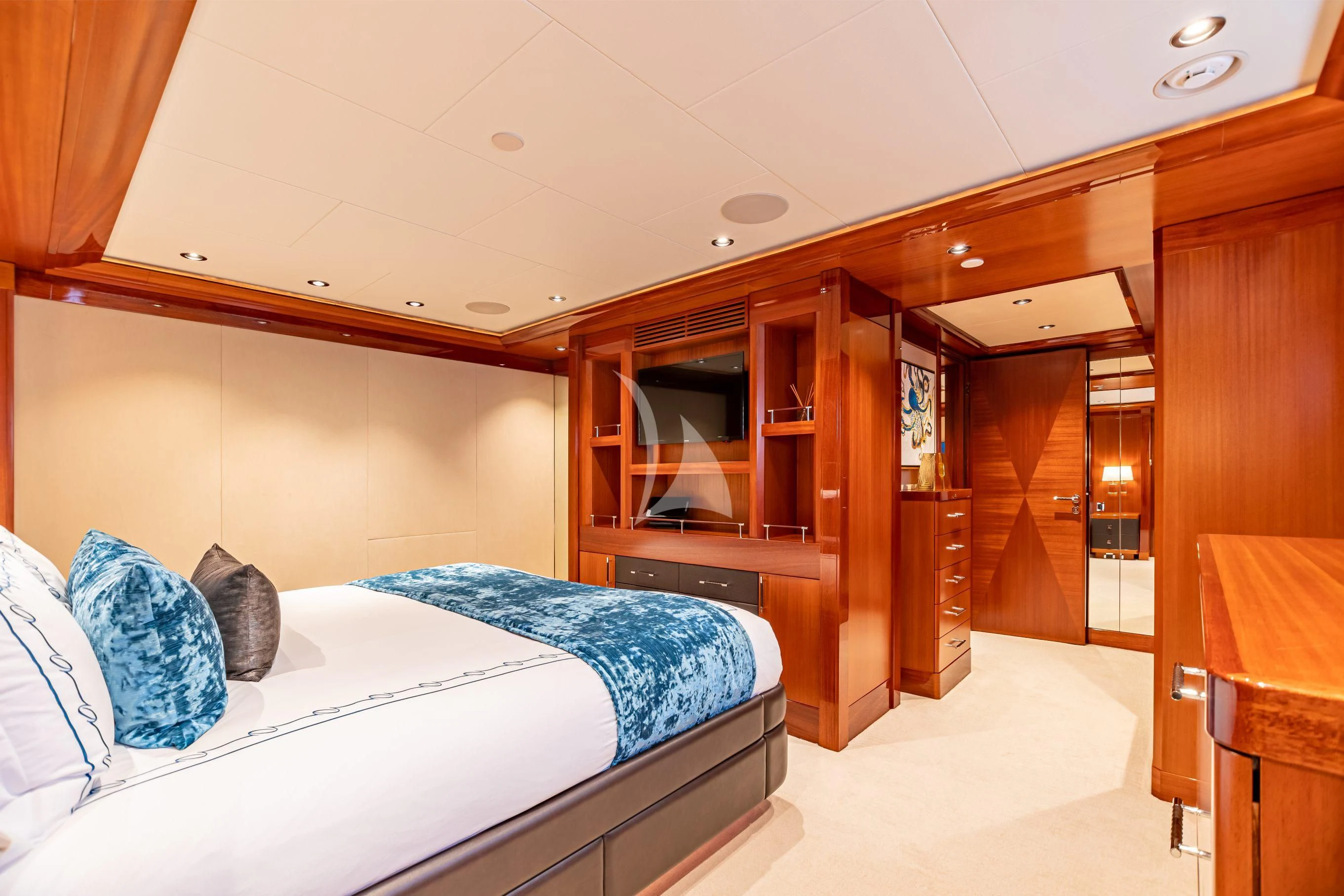 a room with a bed and a closet aboard NEENAH Yacht for Charter