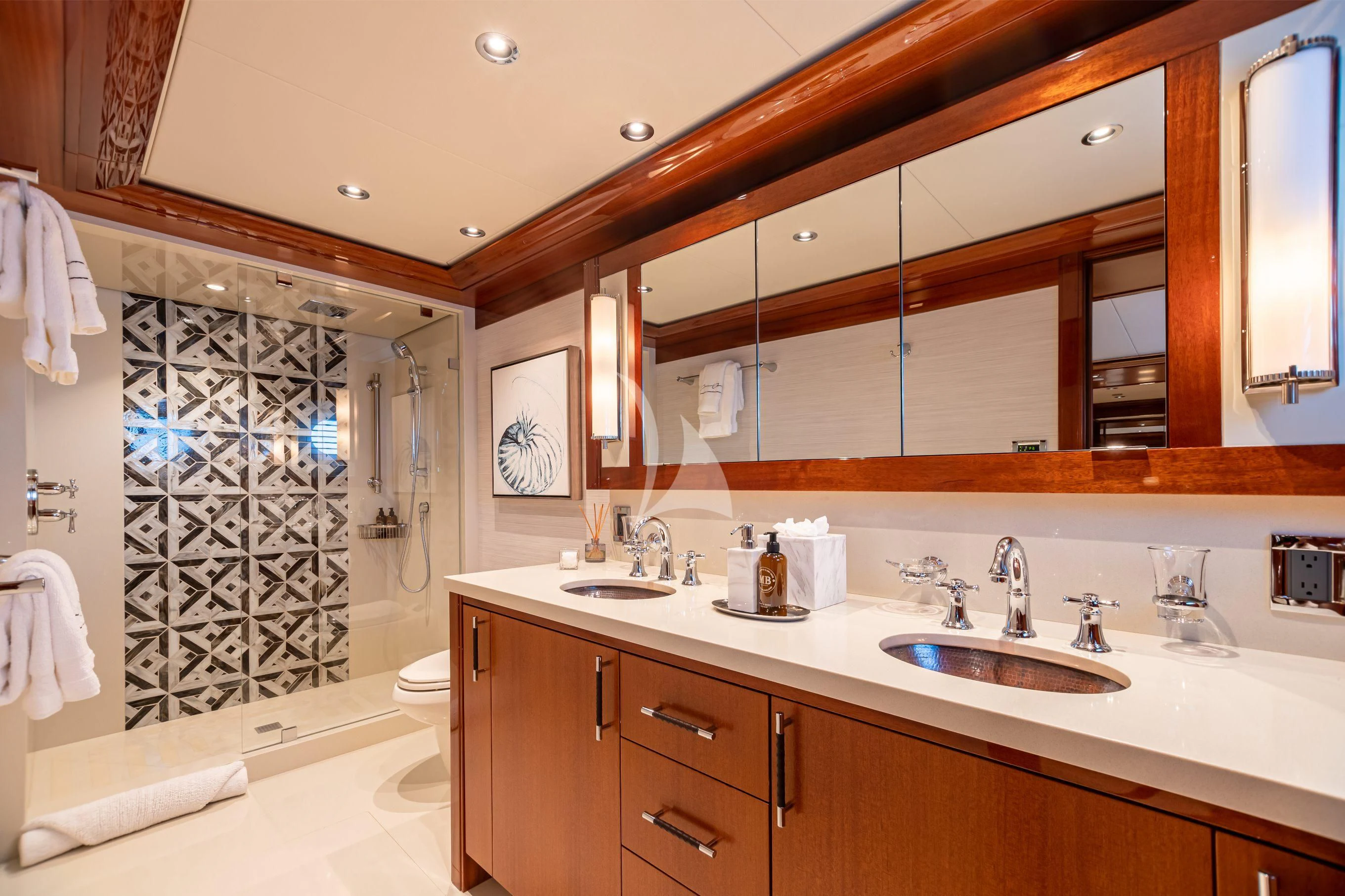a bathroom with a large mirror aboard NEENAH Yacht for Charter