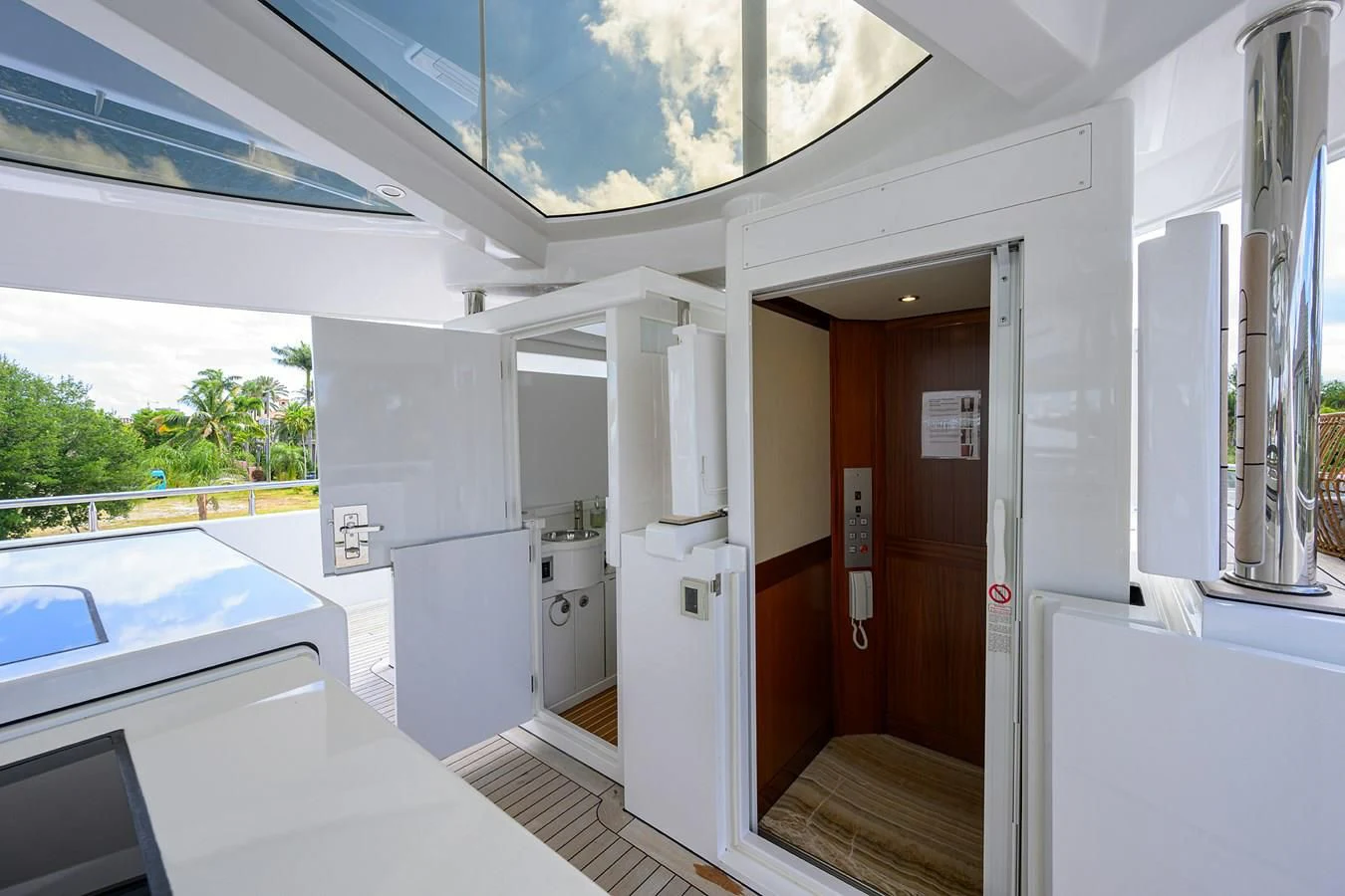 a room with a large window and a view of the outside aboard NEENAH Yacht for Charter