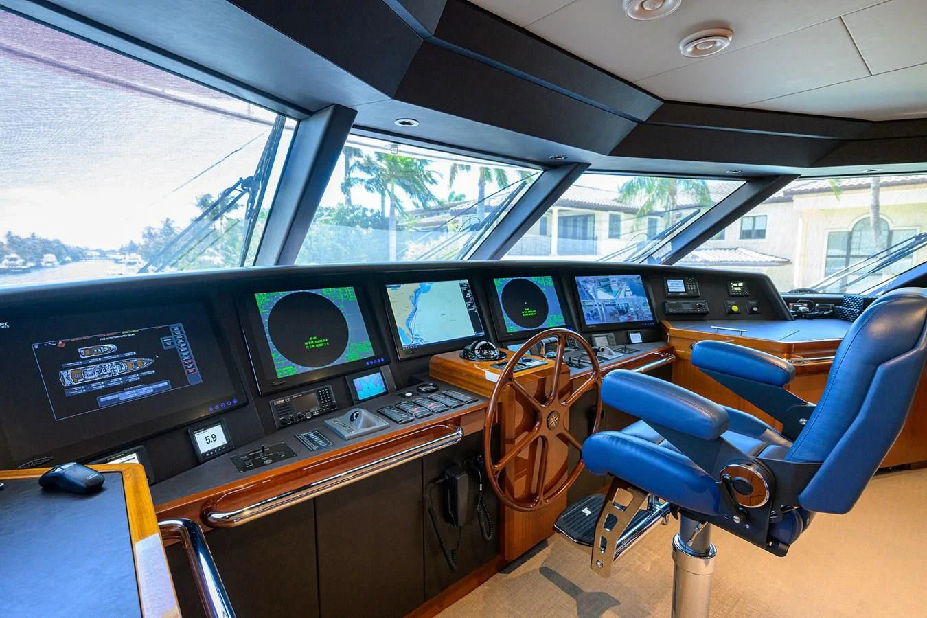 inside of a vehicle with many monitors and seats aboard NEENAH Yacht for Charter