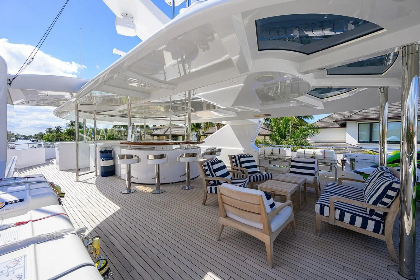 a large white building with tables and chairs aboard NEENAH Yacht for Charter