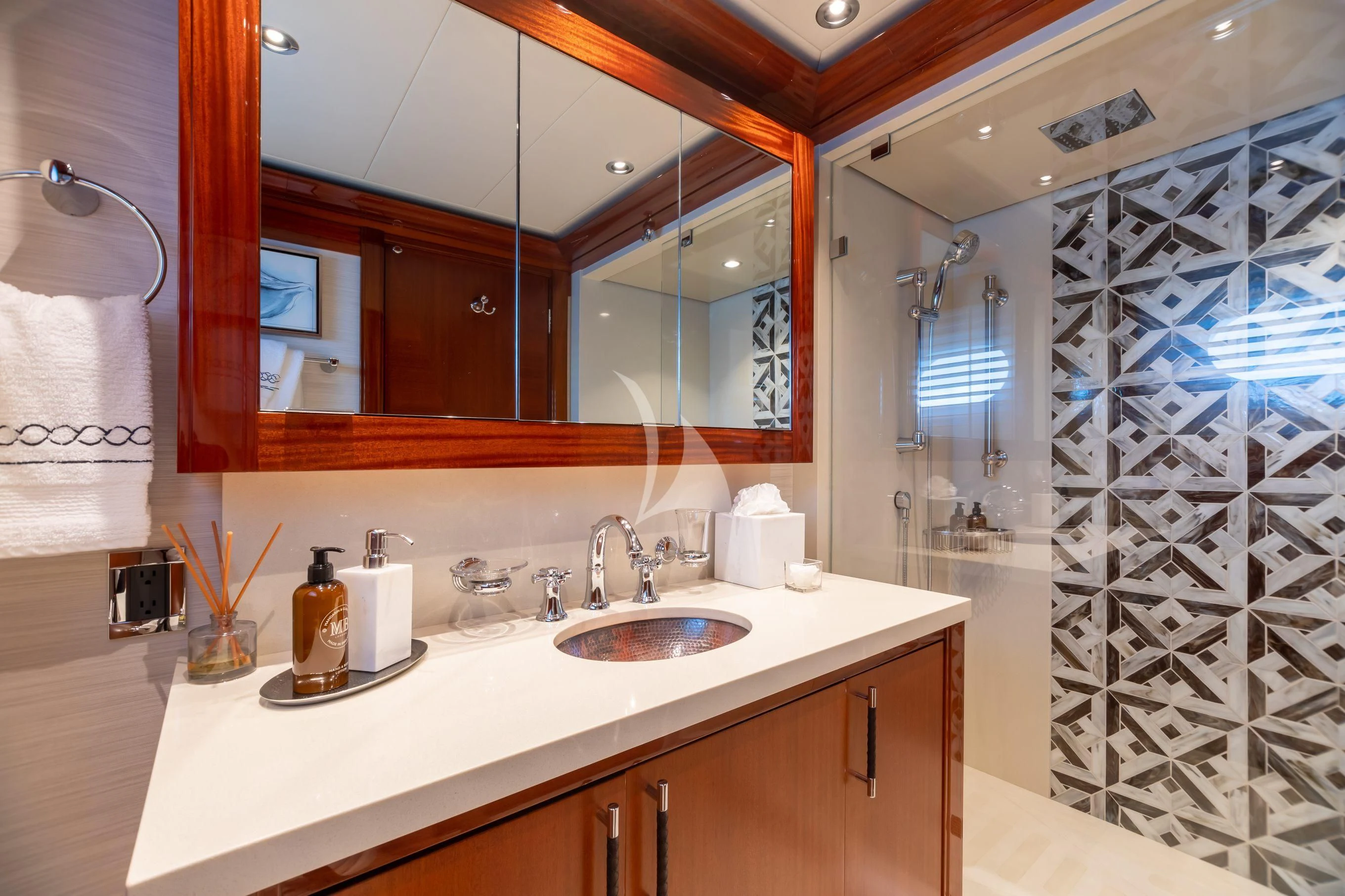 a bathroom with a large mirror aboard NEENAH Yacht for Charter