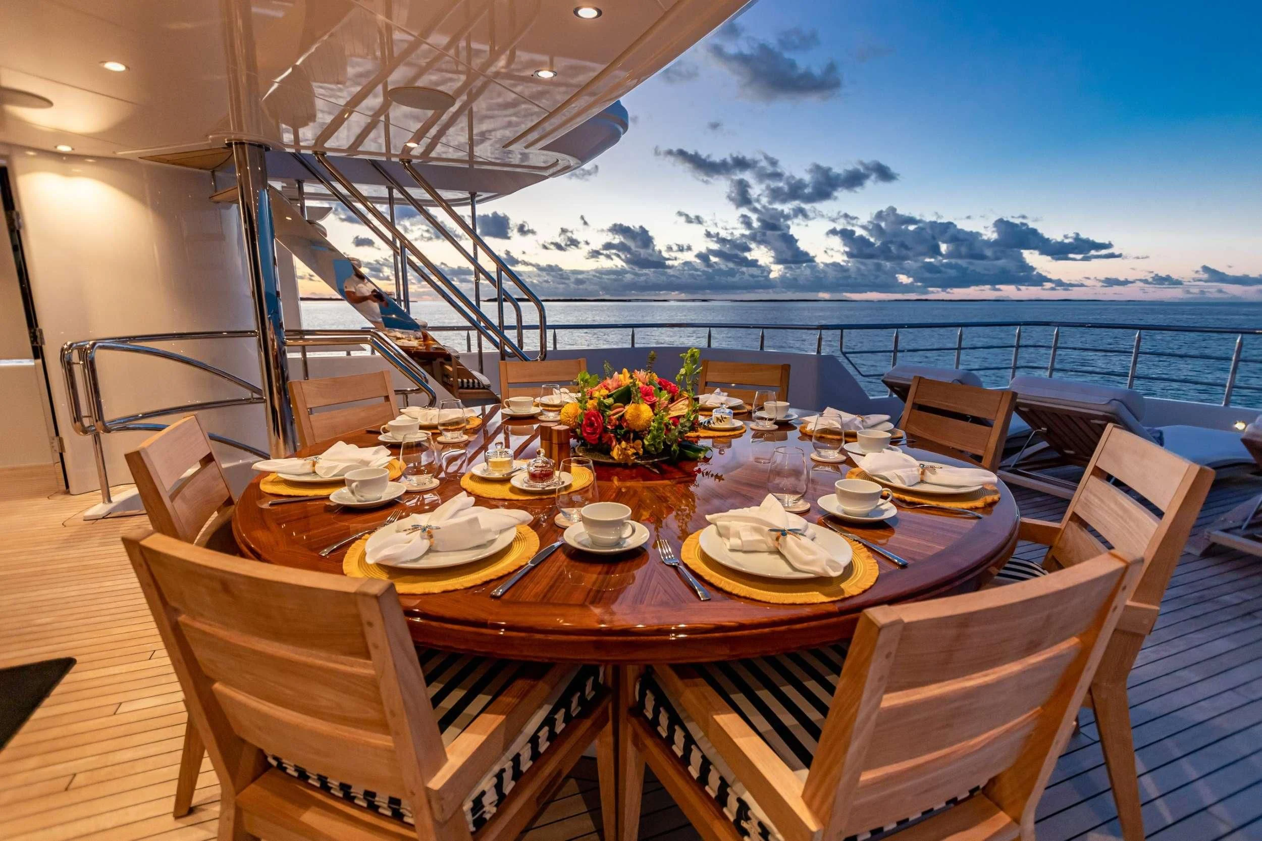 a table set for a meal on a ship aboard NEENAH Yacht for Charter
