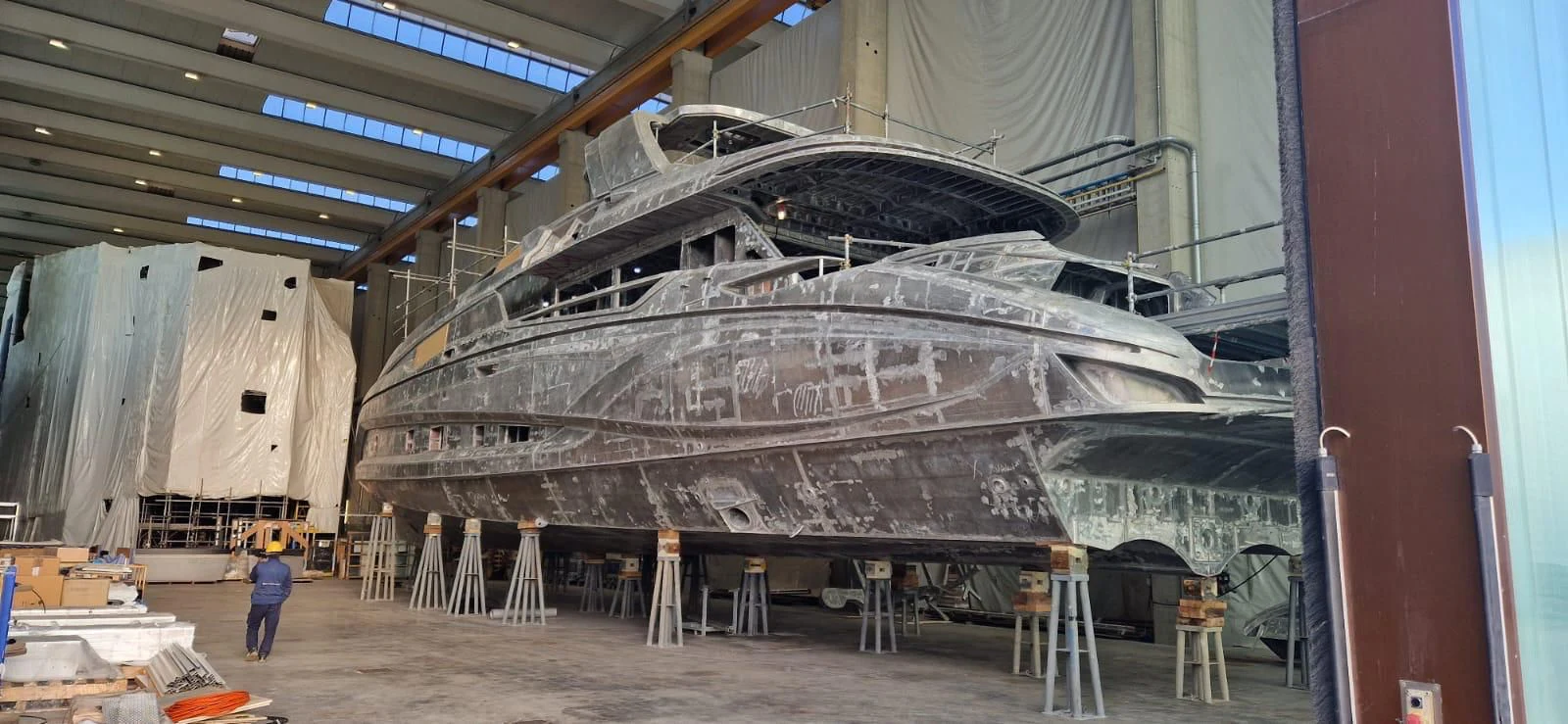 a large metal structure with a person standing in front of it aboard TECNOMAR EVO 120/05 Yacht for Sale