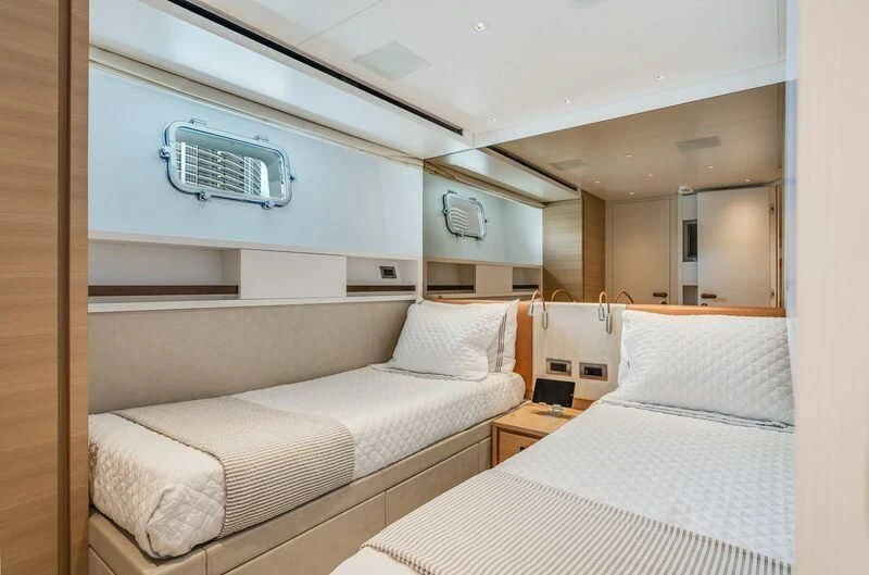 a room with two beds aboard GATSBY Yacht for Charter