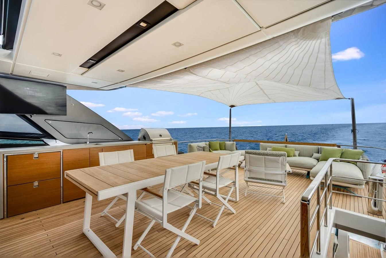 a room with a table and chairs aboard GATSBY Yacht for Charter