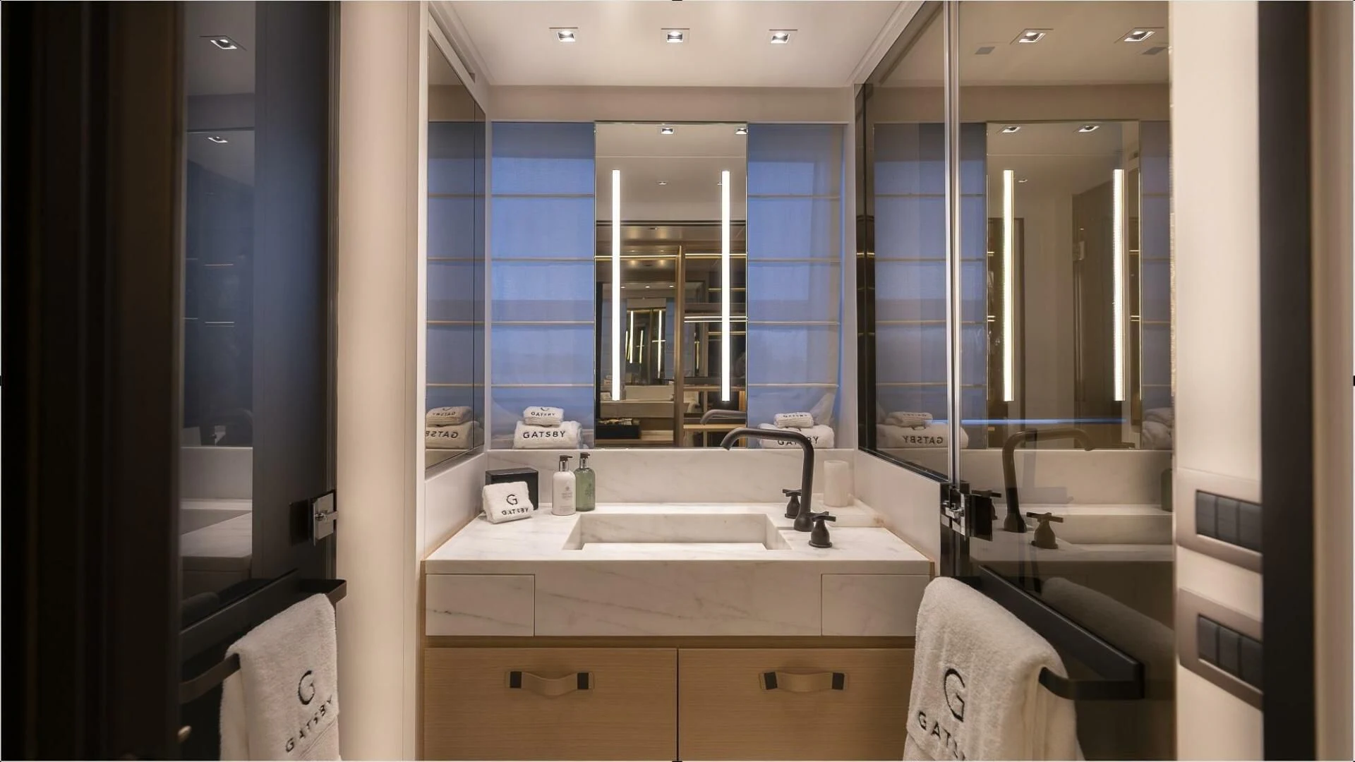 a bathroom with a large mirror aboard GATSBY Yacht for Charter