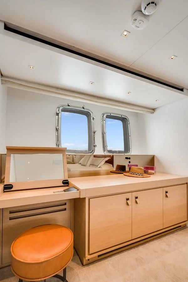 a room with a desk and a window aboard GATSBY Yacht for Charter