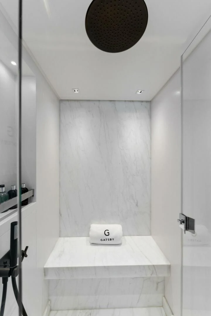 a bathroom with a round white counter aboard GATSBY Yacht for Charter