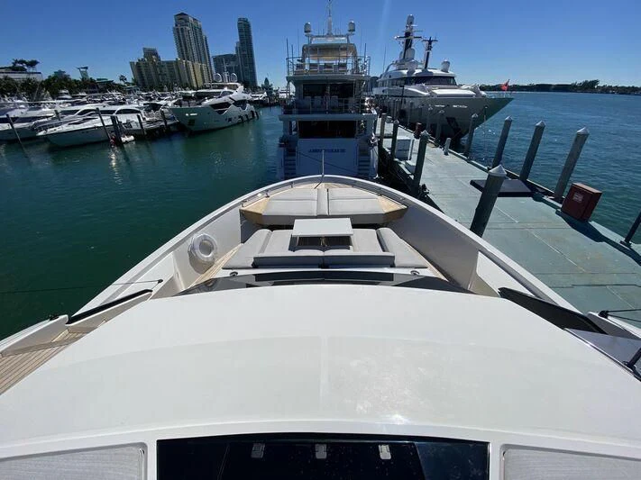 a large white boat in a harbor aboard GATSBY Yacht for Charter