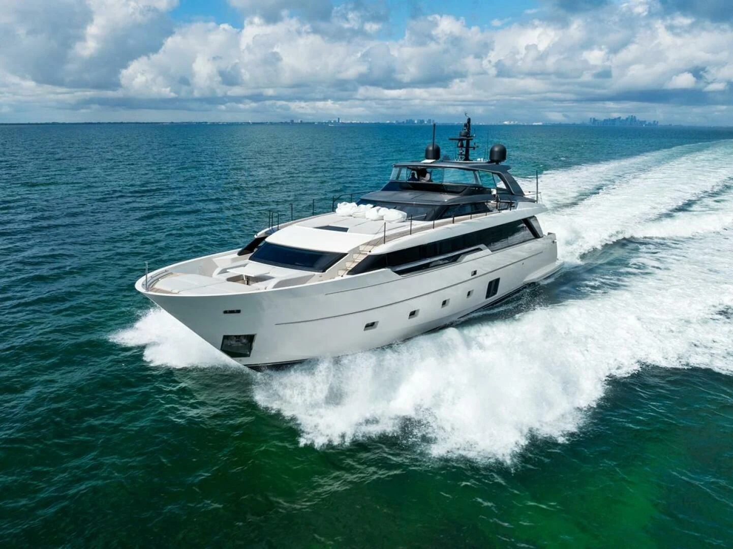 a white yacht on the water aboard GATSBY Yacht for Charter